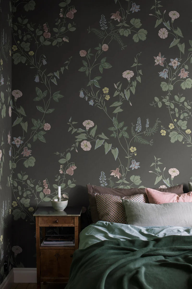 The dark, floral Midsummer Eve Grand wallpaper is an enlarged digital reprint of our hand-painted design of the same name.