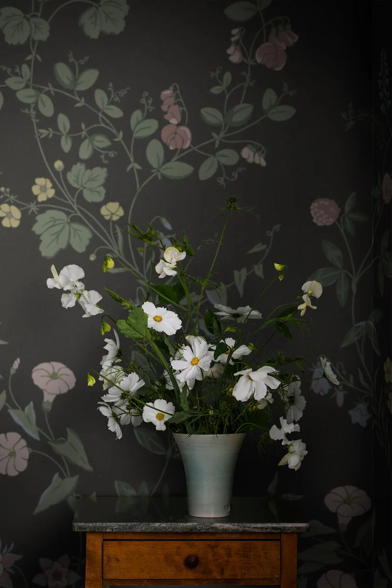 The dark, floral Midsummer Eve Grand wallpaper is an enlarged digital reprint of our hand-painted design of the same name.