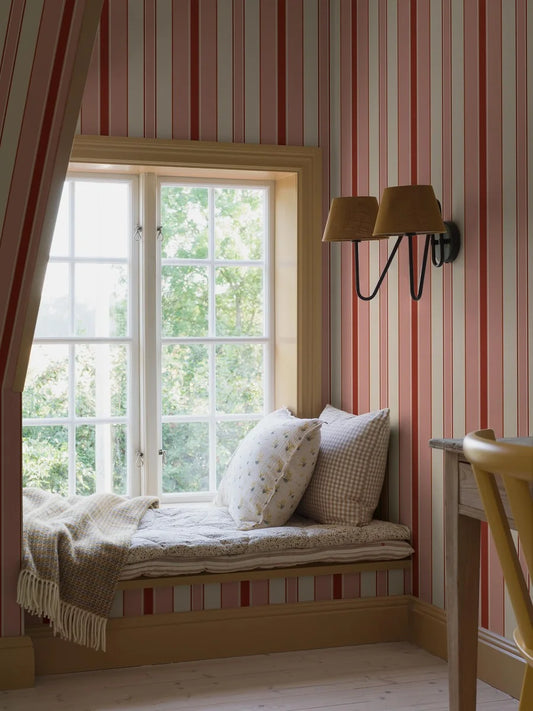 Stockholm Stripe is a striped wallpaper featuring stripes of varying widths and colors – a playful approach that brings delightful dynamism to the timeless pattern. 