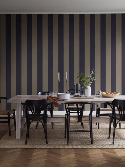 Bjärö Stripe wallpaper comes in linen beige and muted navy blue – an elegant, toned-down color palette that gives the wide stripes a sense of timeless calm.