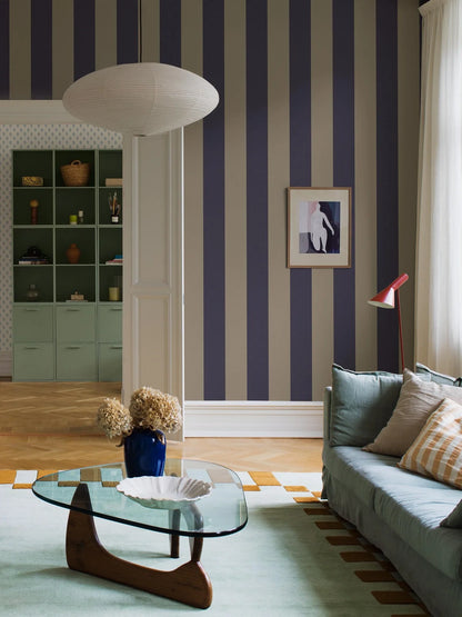 Bjärö Stripe wallpaper comes in linen beige and muted navy blue – an elegant, toned-down color palette that gives the wide stripes a sense of timeless calm.