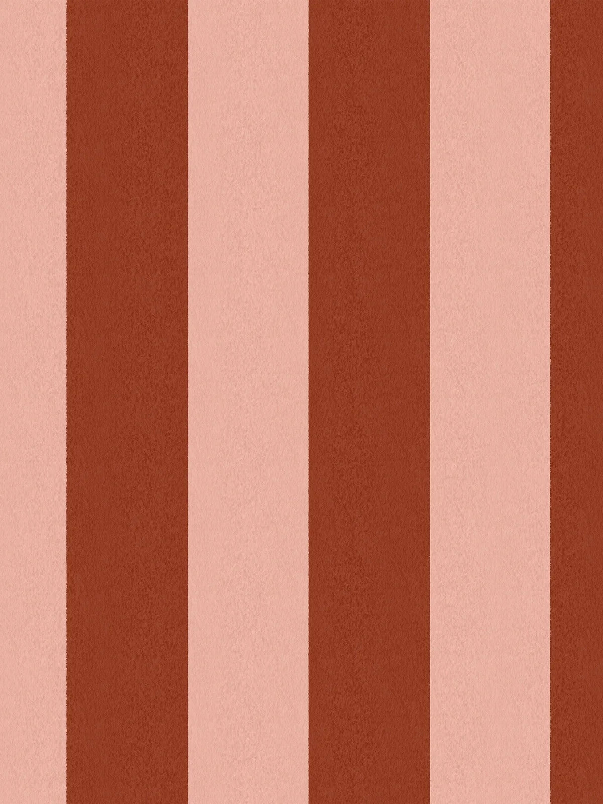 The wide-striped Båstad Stripe wallpaper feels warm and vibrant, with block stripes in raspberry red and warm light pink.