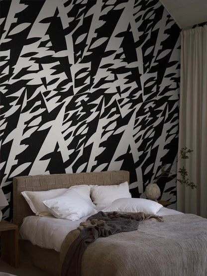 The black-and-white mural wallpaper Delfinisk Rörelse is based on one of Karl Axel Pehrson’s graphic paintings: a stylised image of dolphins in a dense shoal of fish—abstract and representational at the same time.