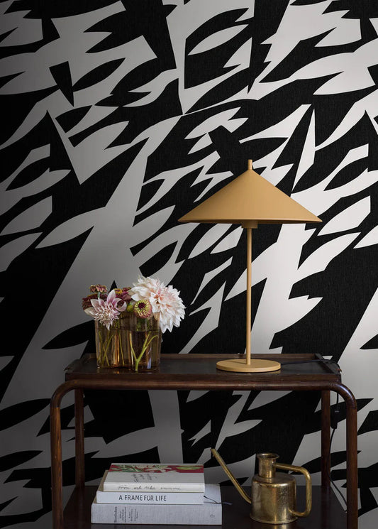 The black-and-white mural wallpaper Delfinisk Rörelse is based on one of Karl Axel Pehrson’s graphic paintings: a stylised image of dolphins in a dense shoal of fish—abstract and representational at the same time.