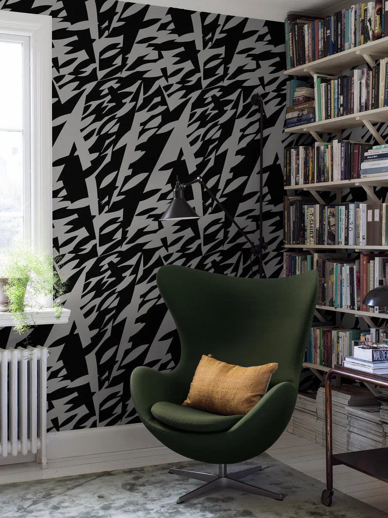 The black-and-white mural wallpaper Delfinisk Rörelse is based on one of Karl Axel Pehrson’s graphic paintings: a stylised image of dolphins in a dense shoal of fish—abstract and representational at the same time.