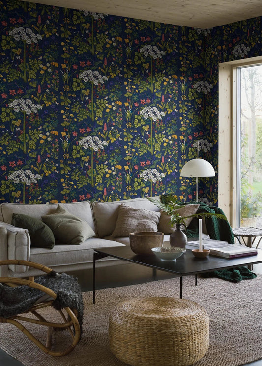 The mural wallpaper Aurora features one of Lisbet Jobs’ most beloved patterns, with flowers such as hogweed, dandelion, cowslip and lily of the valley, here in bright colors on a deep blue ground.