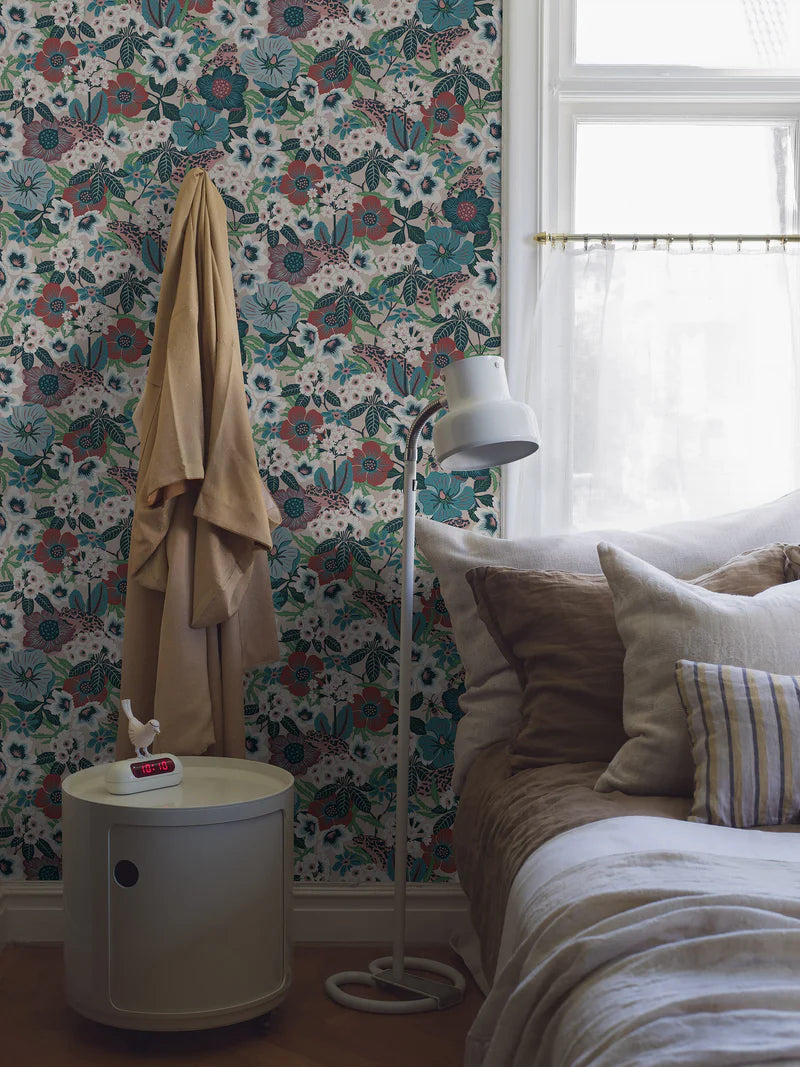 Hanna Werning is known for her lush botanical patterns with a humorous twist, and the floral mural wallpaper Kvackstepp is no exception. 