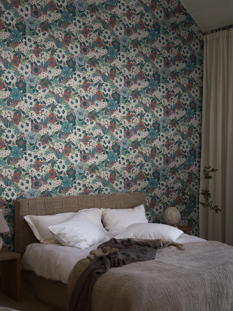 Hanna Werning is known for her lush botanical patterns with a humorous twist, and the floral mural wallpaper Kvackstepp is no exception. 