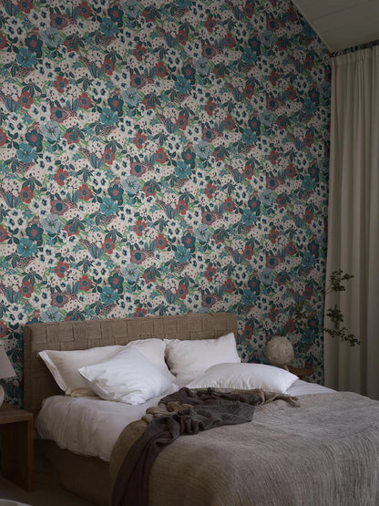 Hanna Werning is known for her lush botanical patterns with a humorous twist, and the floral mural wallpaper Kvackstepp is no exception. 