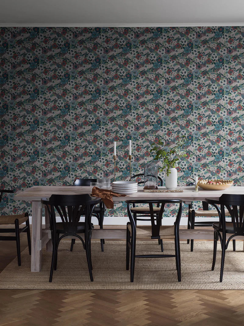 Hanna Werning is known for her lush botanical patterns with a humorous twist, and the floral mural wallpaper Kvackstepp is no exception. 