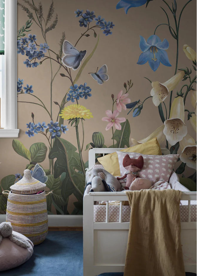 Like stepping into a sun-dappled meadow in full bloom, the Bluebell Magic mural wallpaper invites little ones into a magical world of oversized wildflowers