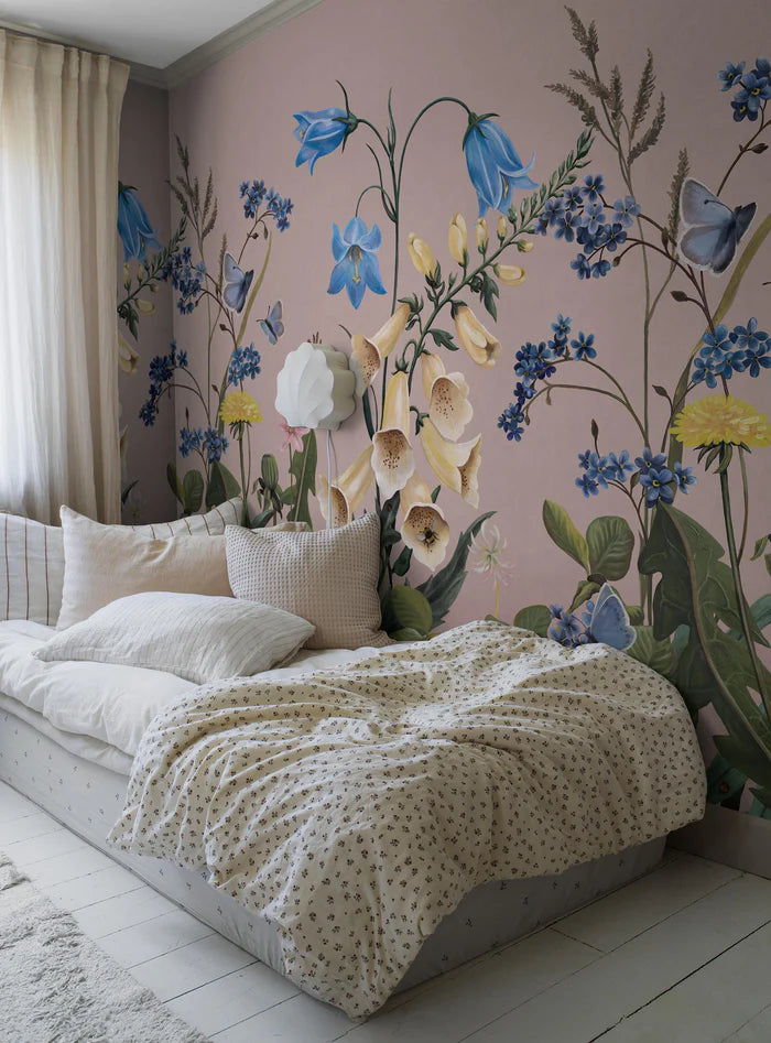 A blooming meadow of forget-me-nots, clover, dandelions and bluebells comes to life on the Bluebell Magic mural wallpaper.