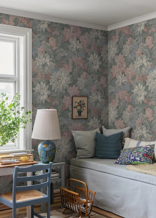 Here, Delilah Grand Wallpaper murals lush dahlia design appears in a soft pastel palette: flowers in muted shades of pink, blue, grey and white set against light blue-green foliage.