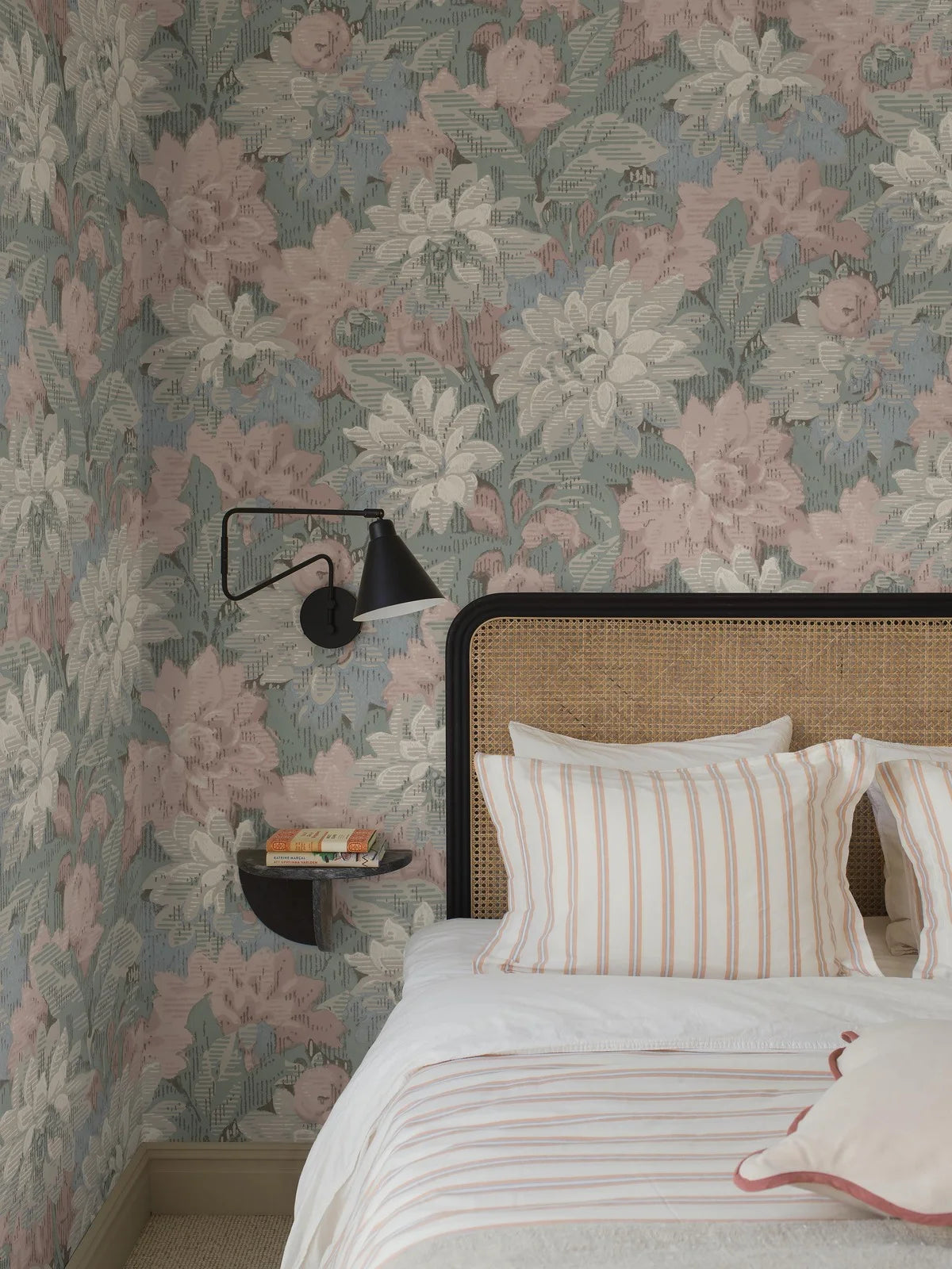 Here, Delilah Grand Wallpaper murals lush dahlia design appears in a soft pastel palette: flowers in muted shades of pink, blue, grey and white set against light blue-green foliage.