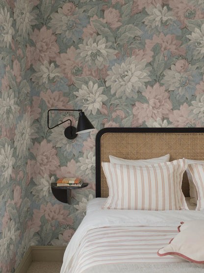 Here, Delilah Grand Wallpaper murals lush dahlia design appears in a soft pastel palette: flowers in muted shades of pink, blue, grey and white set against light blue-green foliage.