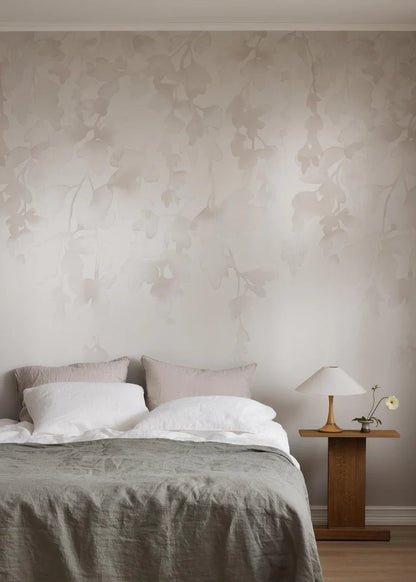 The light wallpaper mural Dawn Forest features hand-painted watercolor foliage that drapes softly down the wall. 
