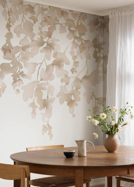 The Dawn Forest wallpaper mural is adorned with delicate, hanging foliage hand-painted in watercolor