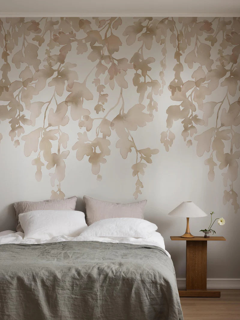 The Dawn Forest wallpaper mural is adorned with delicate, hanging foliage hand-painted in watercolor