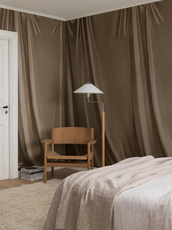 Drape is a hand-painted trompe-l'œil wallpaper mural with soft drapery that deceives the eye and gives the room a beautiful textile feel. 