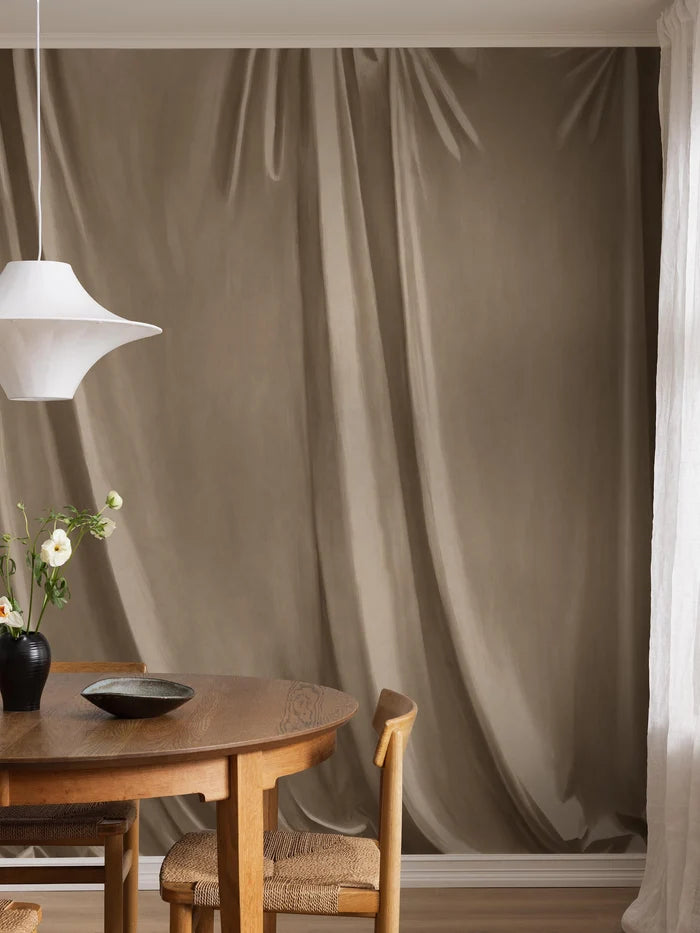 Drape is a hand-painted trompe-l'œil wallpaper mural with soft drapery that deceives the eye and gives the room a beautiful textile feel. 