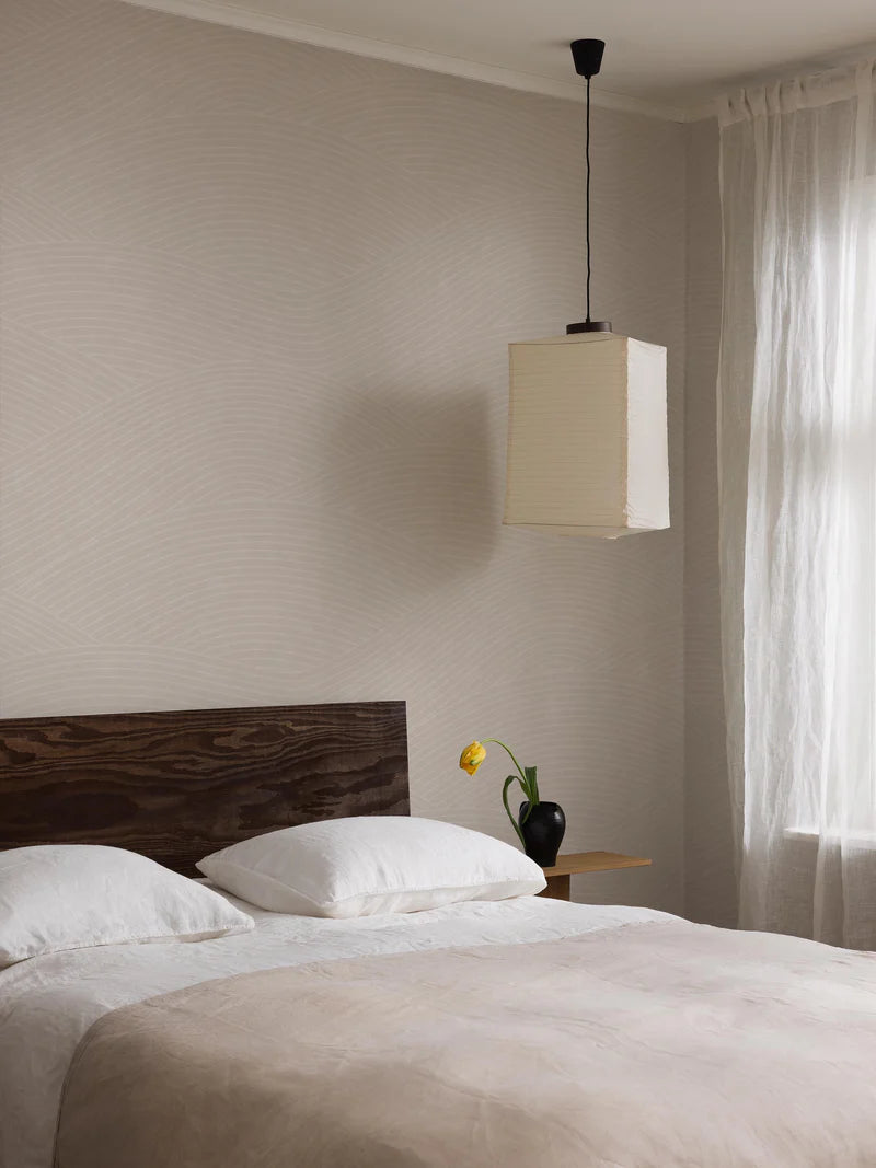 The Haväng Grand wallpaper mural creates a tranquil pattern of sweeping lines, inspired by the fields of Österlen.