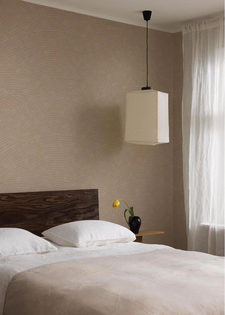 The Haväng Grand wallpaper mural creates a tranquil pattern of sweeping lines, inspired by the fields of Österlen.
