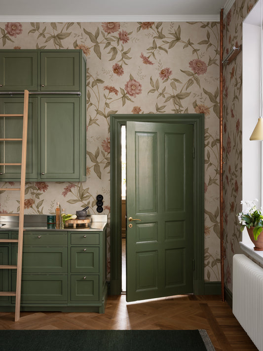 Zinnia Grand All Over is a large-scale floral wallpaper with a softly flowing trail of zinnias climbing across the wall. 