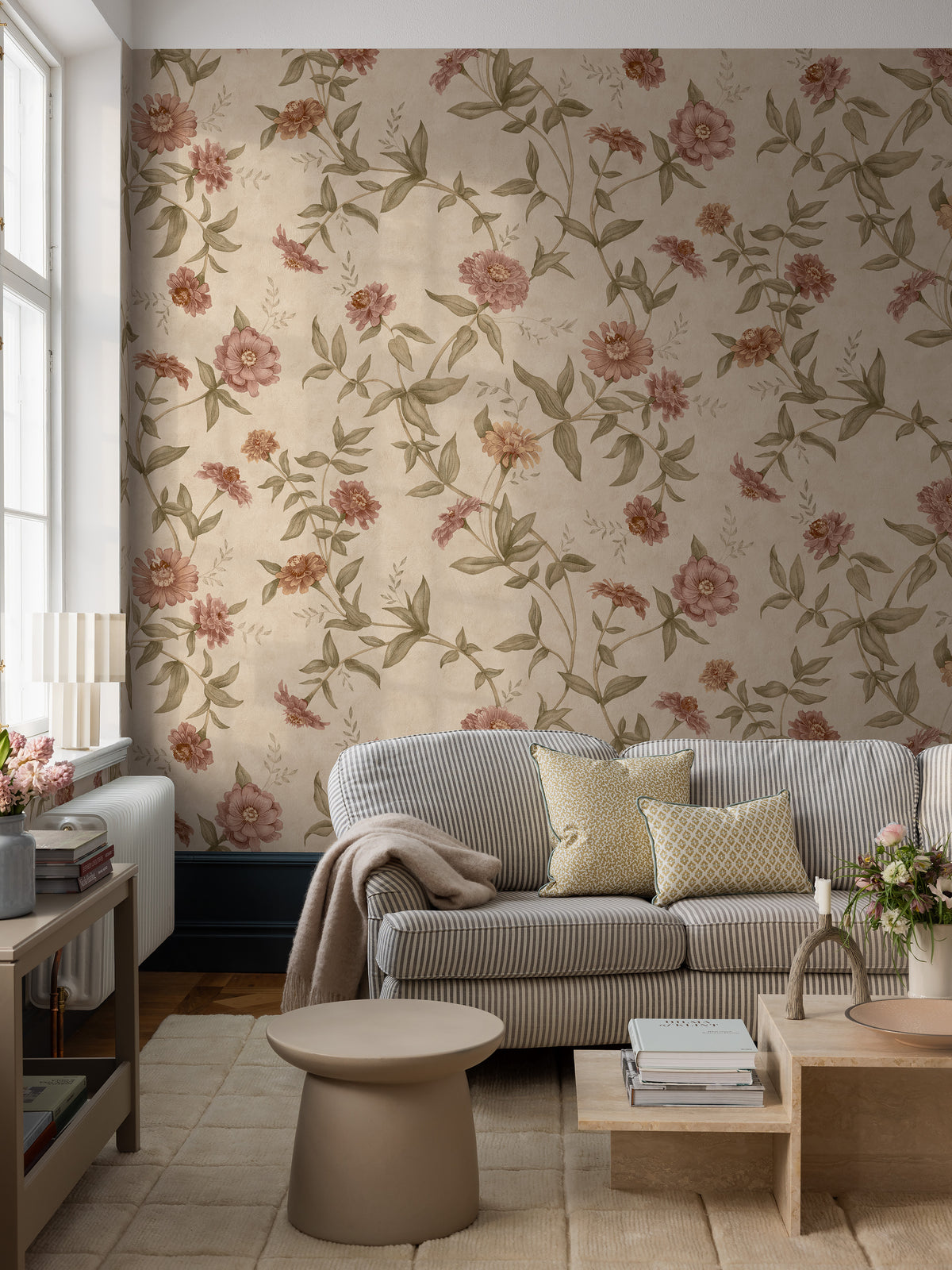 Zinnia Grand All Over is a large-scale floral wallpaper with a softly flowing trail of zinnias climbing across the wall. 