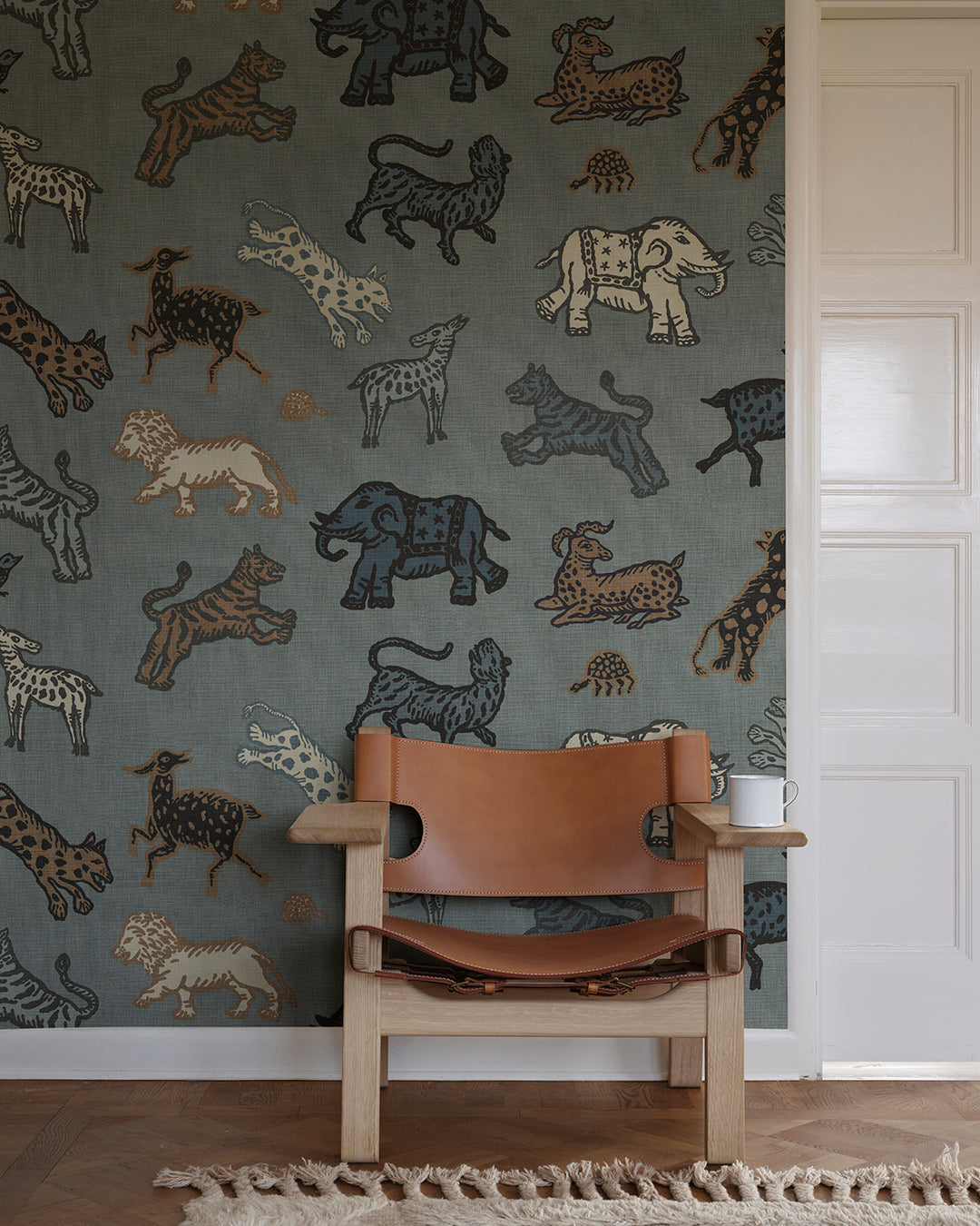 A true Sandberg classic. Inspired by Indian tapestries, these imaginative animals on a rich red background lend an international feel with a tone that is both playful and becoming.