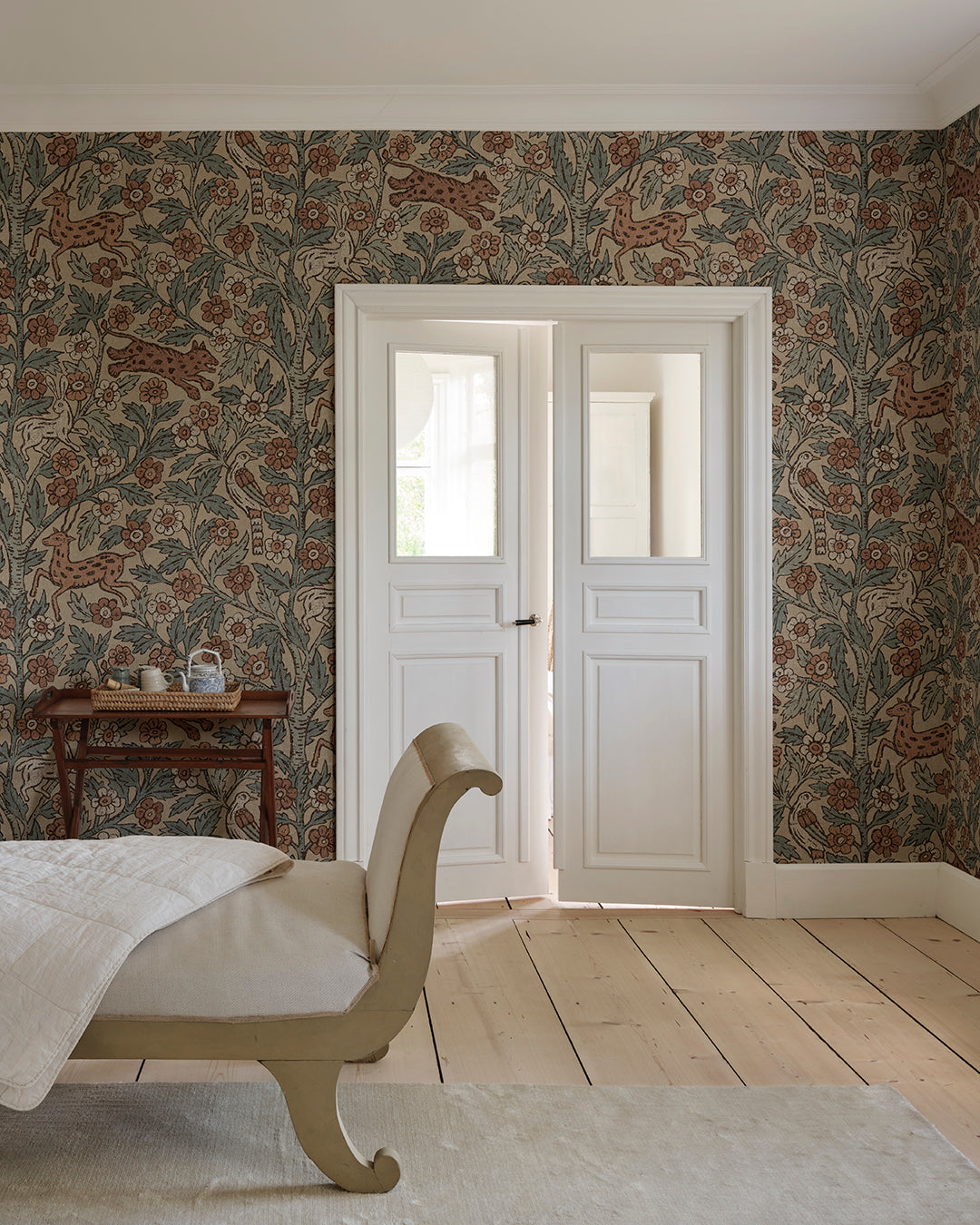 This wallpaper mural is inspired by Indian textile art and Arts & Crafts, creating a fantastic pictorial narrative with history and patina
