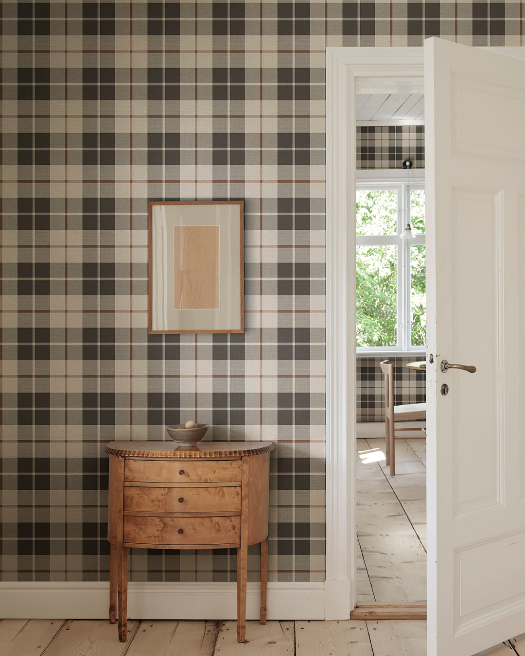 Ranold was in the assortment for a long time as a traditionally printed wallpaper, and now we have made a new interpretation on a larger scale mural and added a textile character.