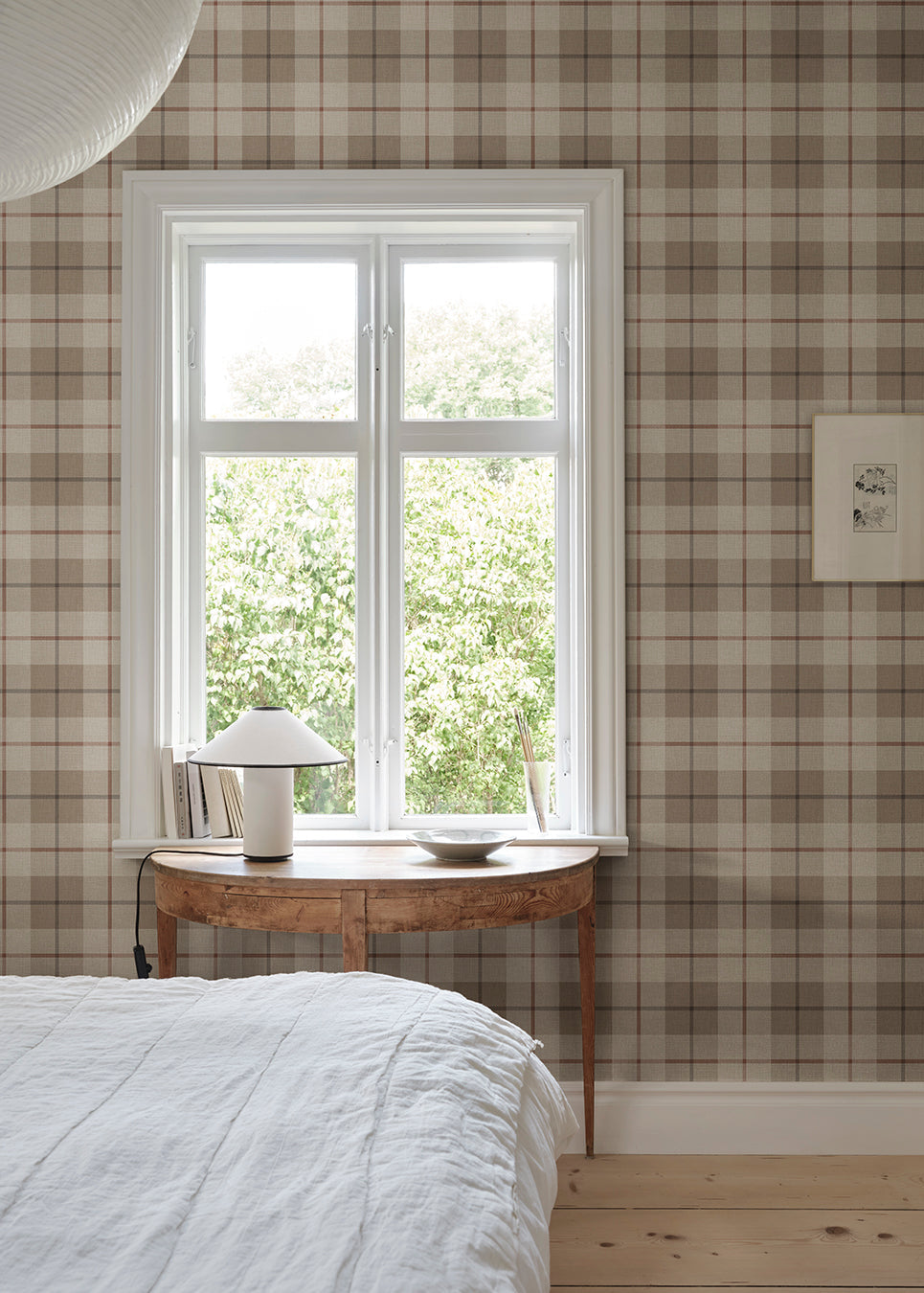 Ranold was in the assortment for a long time as a traditionally printed wallpaper, and now we have made a new interpretation on a larger scale mural and added a textile character.