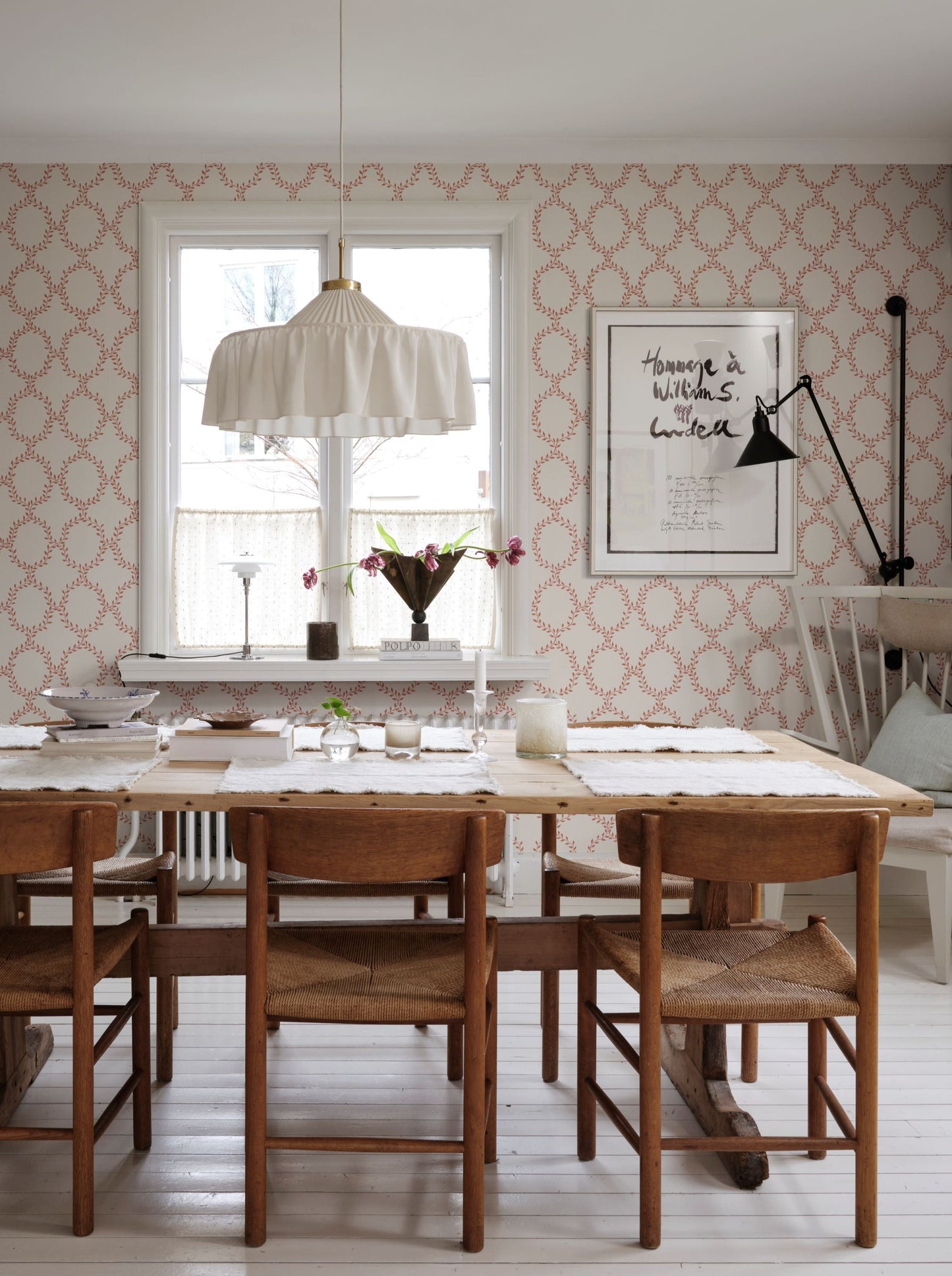 Our beloved wallpaper design Wilma brings to mind wreaths but in colors with an international feel.