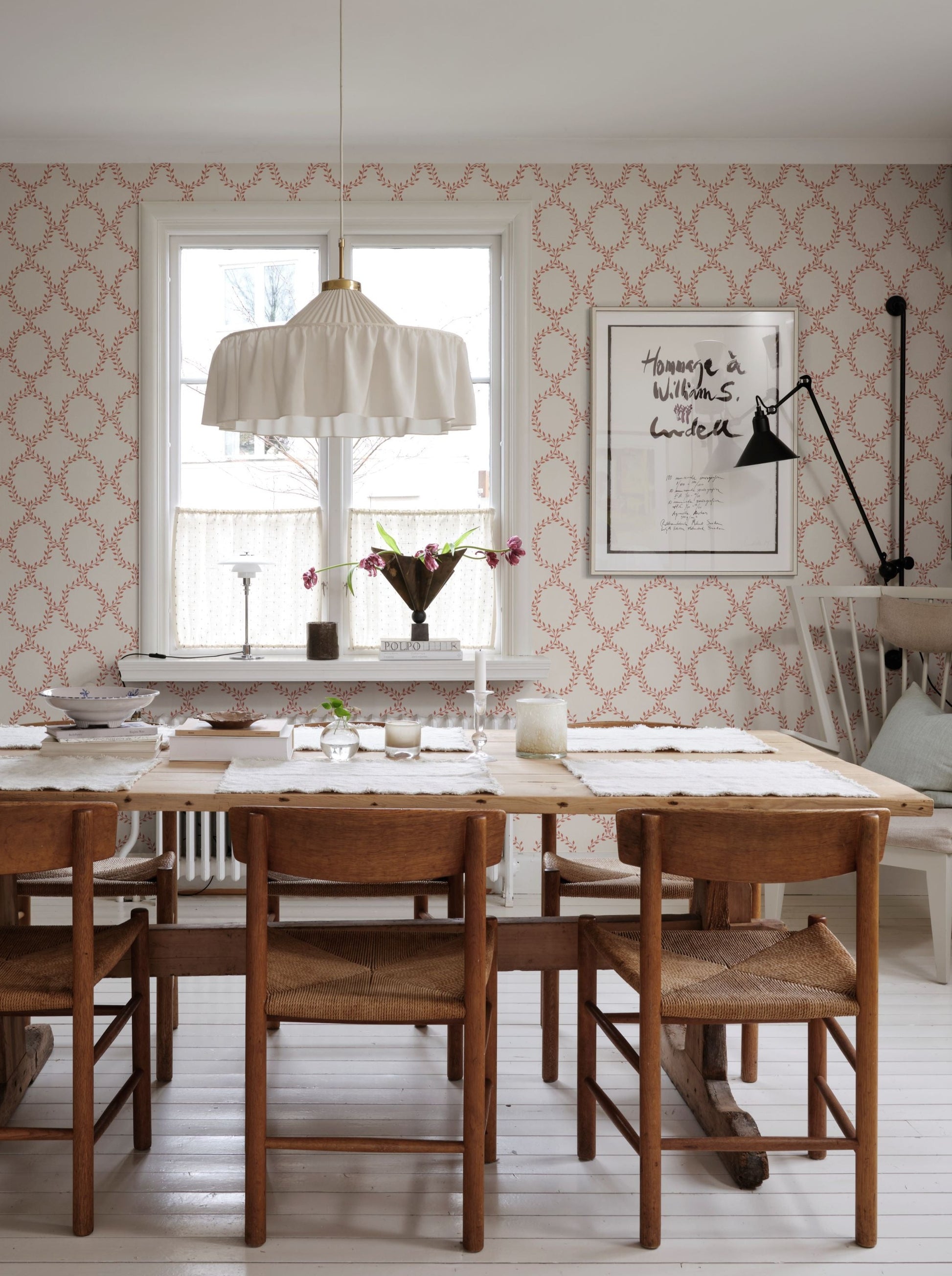 Our beloved wallpaper design Wilma brings to mind wreaths but in colors with an international feel.