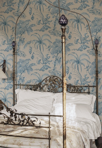 Moa, Indigo Blue wallpaper features a soft beige background with intricate botanical illustrations in indigo blue.