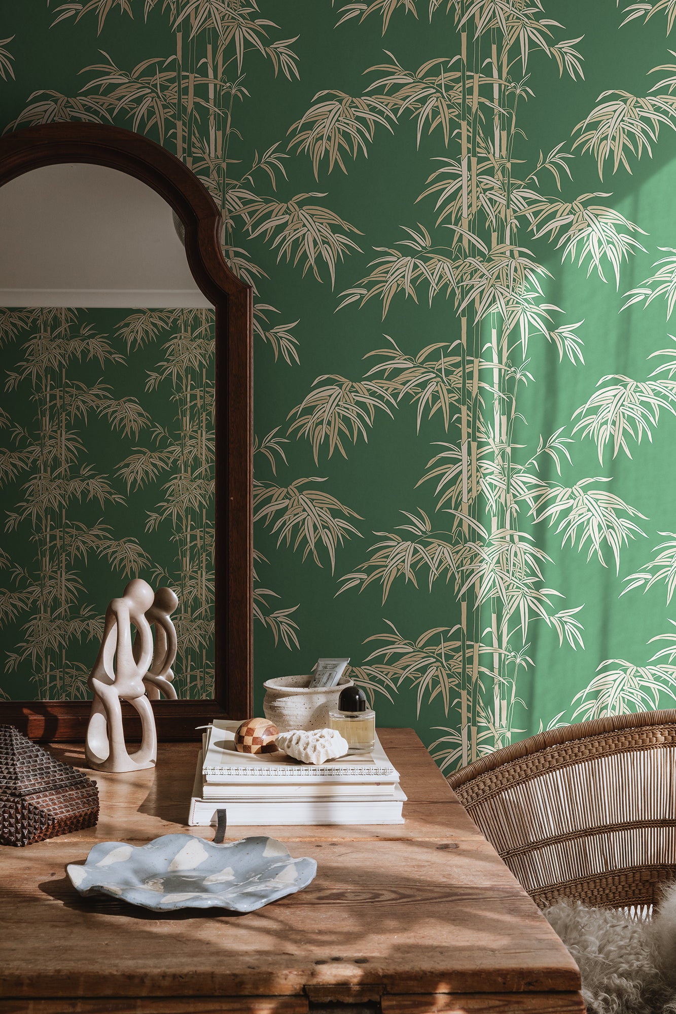 The wallpaper Leon, Green has a rich green background with beige and lighter green accents.