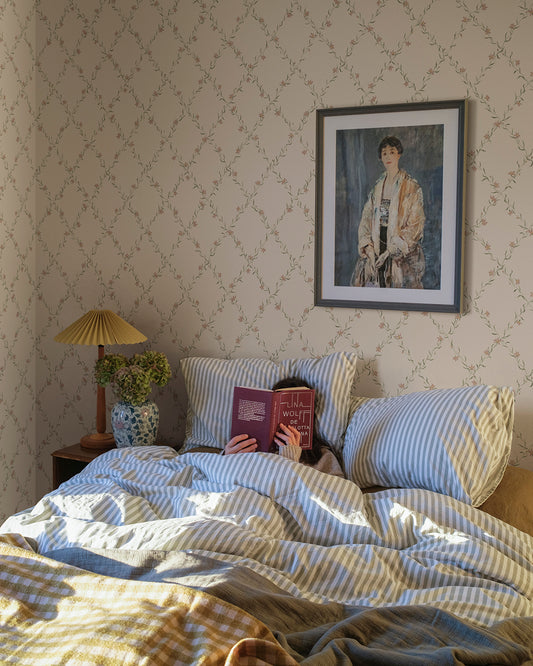  Our beloved Ewa wallpaper dresses your walls with gracefully hand painted cornflower garlands. 