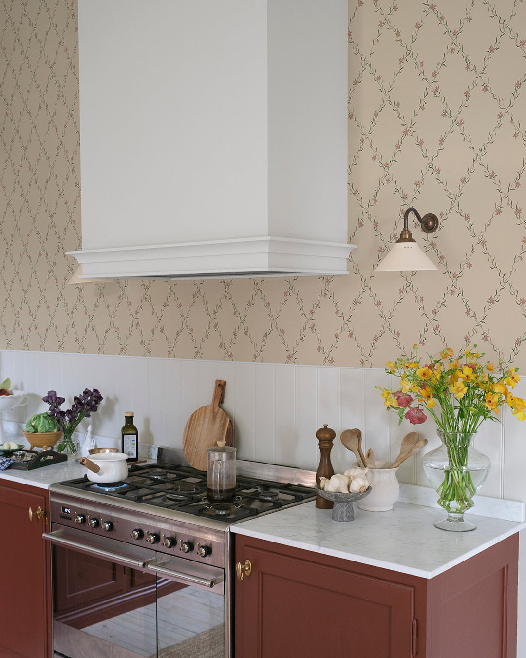  Our beloved Ewa wallpaper dresses your walls with gracefully hand painted cornflower garlands. 
