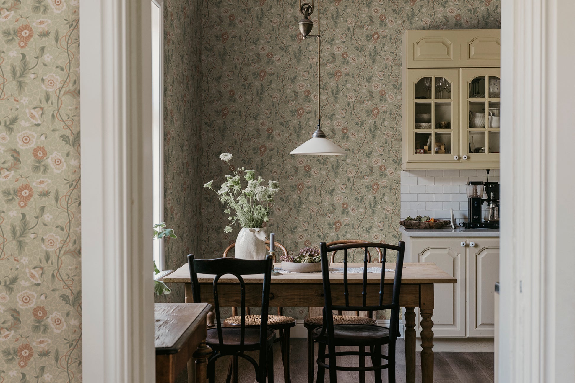  Japanese anemones, cup-and-saucer vines, and avens intertwined offer a softly verdant Arts &amp; Crafts-inspired wallpaper with intricate details and an enveloping character. 