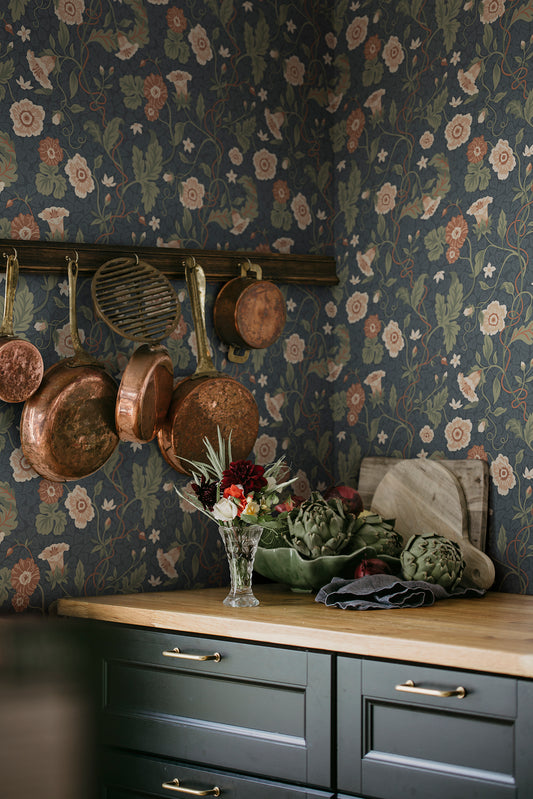 Japanese anemones, cup-and-saucer vines, and avens intertwined offer a softly verdant Arts &amp; Crafts-inspired wallpaper with intricate details and an enveloping character.