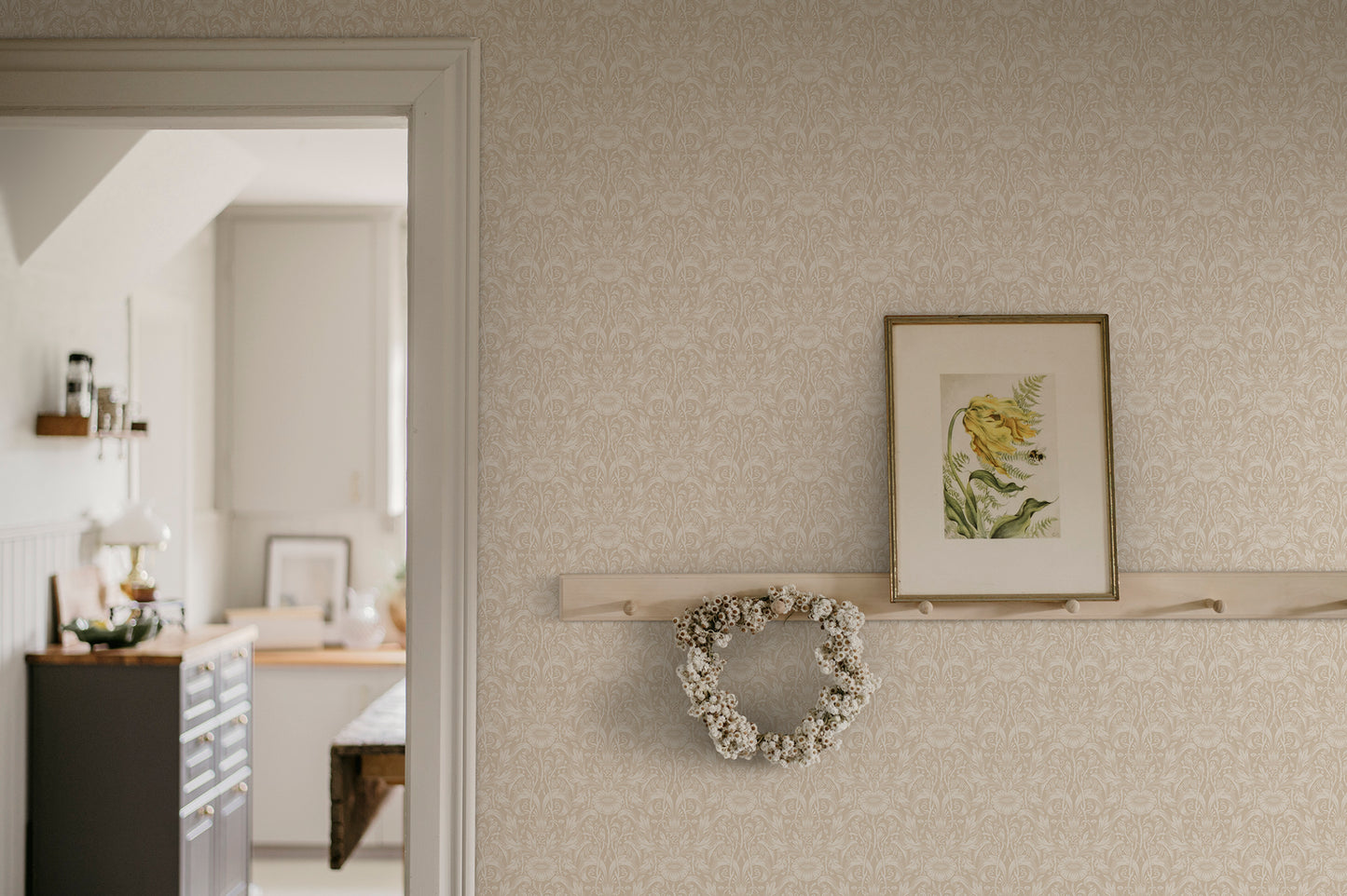 Emil is our interpretation of a classic medallion wallpaper pattern, featuring an intriguing richness of details with leaves and arching stems.