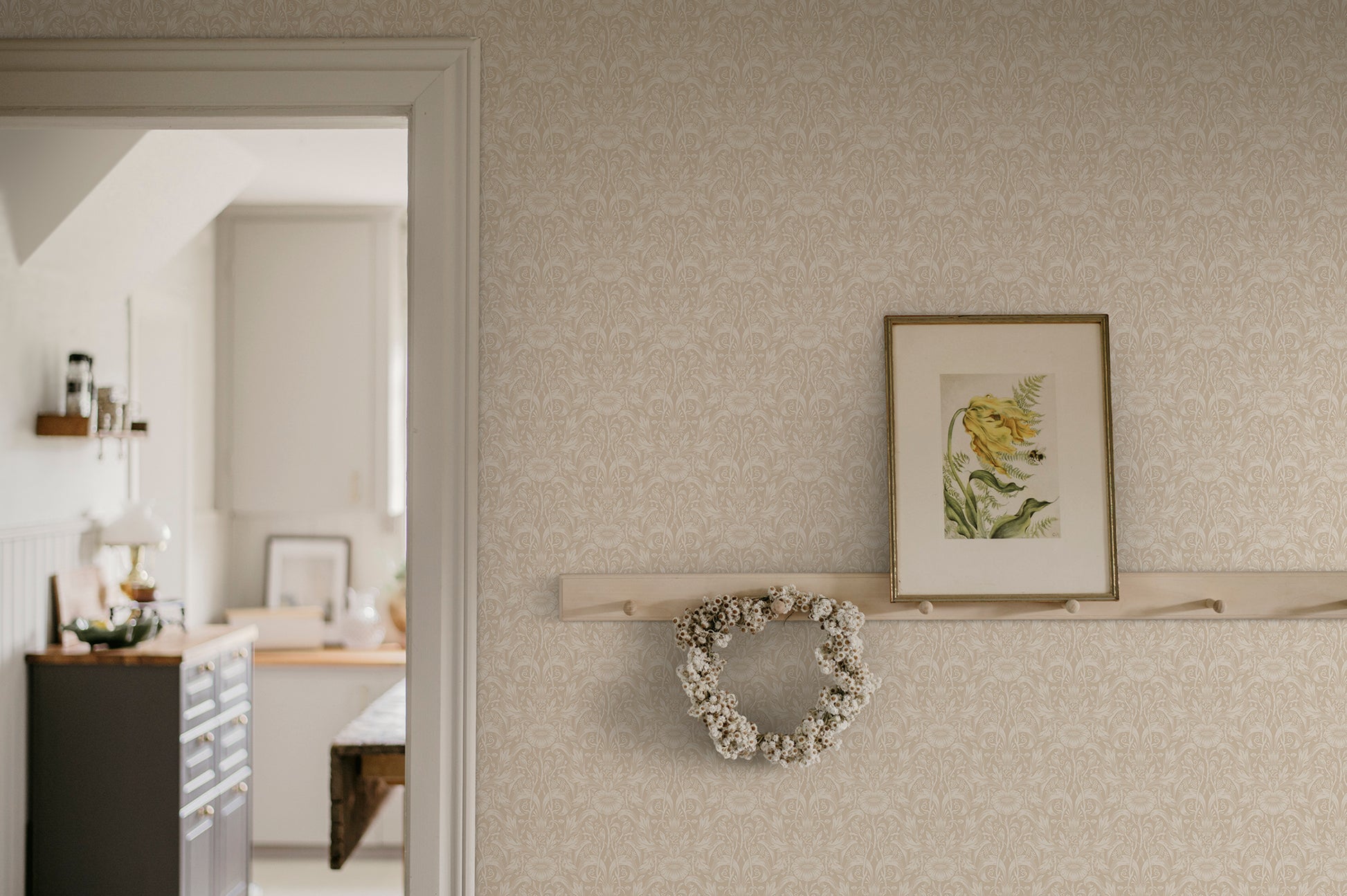 Emil is our interpretation of a classic medallion wallpaper pattern, featuring an intriguing richness of details with leaves and arching stems.