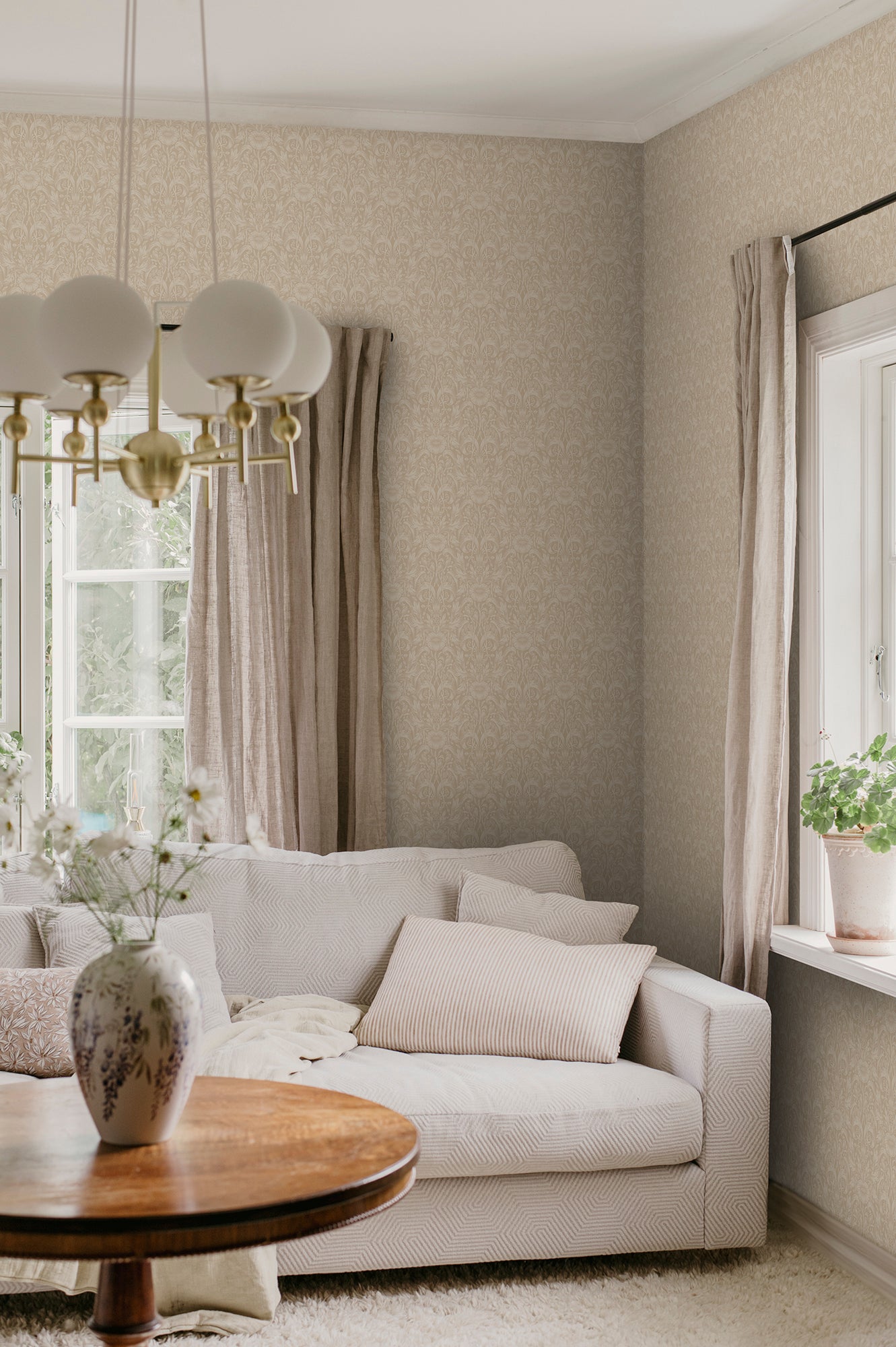 Emil is our interpretation of a classic medallion wallpaper pattern, featuring an intriguing richness of details with leaves and arching stems.