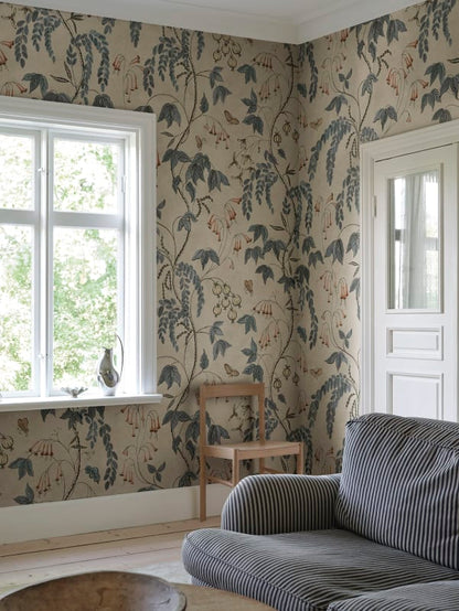 Ottilia, Misty Blue wallpaper has a warm beige background with deep blue and muted red florals.