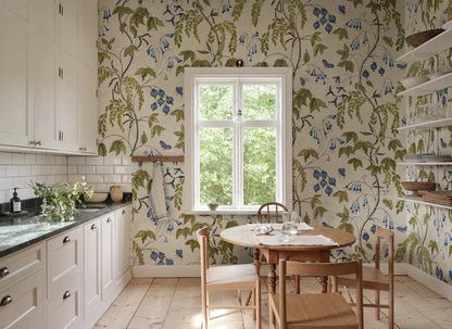  Ottilia, Olive Green wallpaper presents a soft cream background with vibrant green, purple, and soft blue florals.
 
