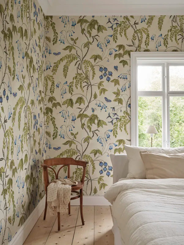  Ottilia, Olive Green wallpaper presents a soft cream background with vibrant green, purple, and soft blue florals.
 
