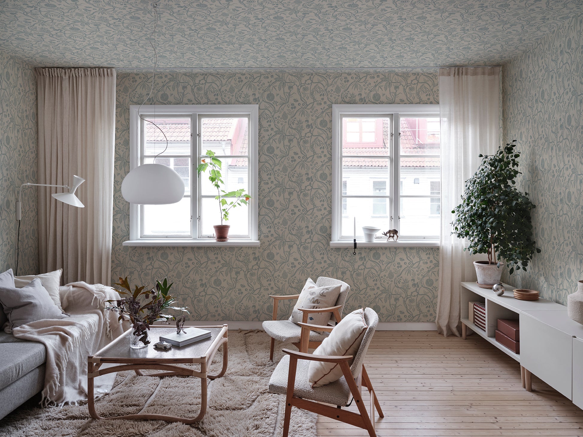 Discover the timeless allure of our Tree of Life wallpaper in soothing light blue tones.