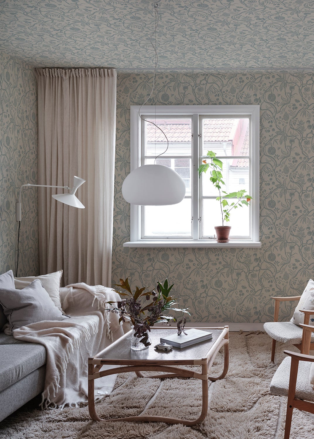 Discover the timeless allure of our Tree of Life wallpaper in soothing light blue tones.