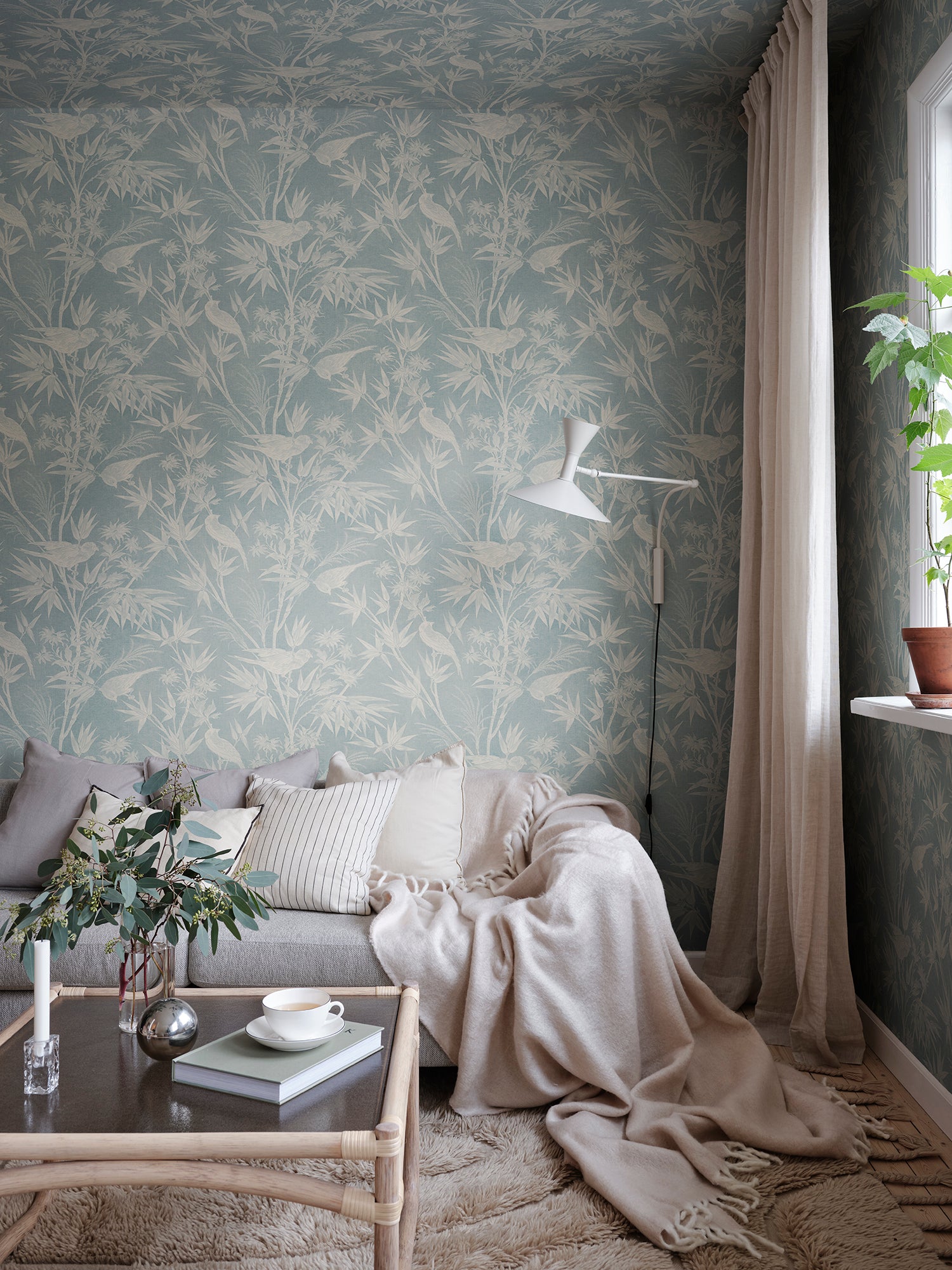 Celeste Misty Blue wallpaper offers a classic toile feel with a soft textile appearance.
