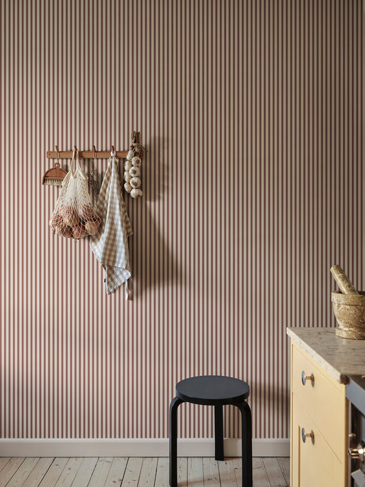 Estelle Burgundy wallpaper transforms your space with its narrow block stripe design, bringing a contemporary and graphic appeal to your walls.